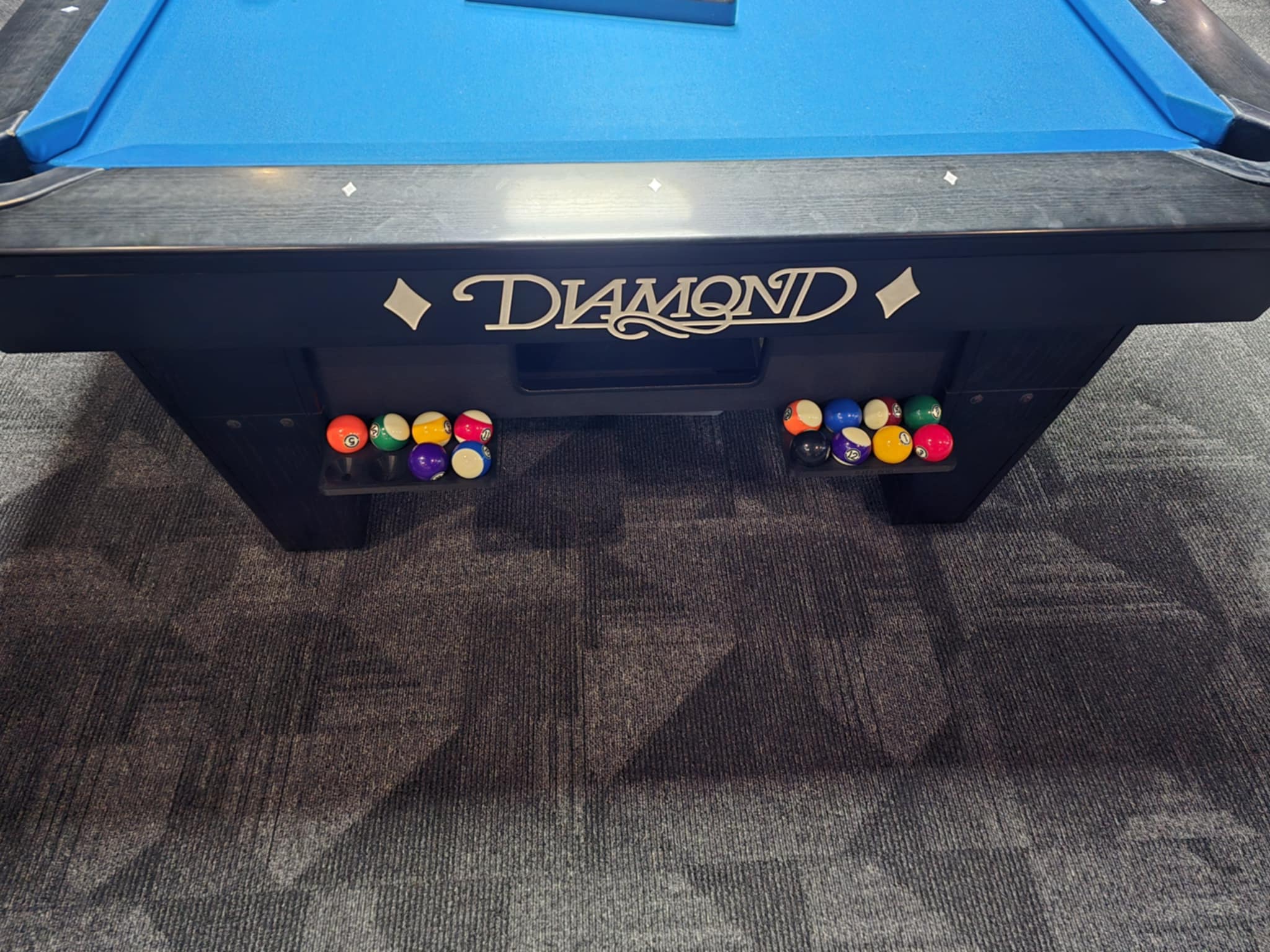 Ball Pod mounted on a pool table during a 9‑ball game.