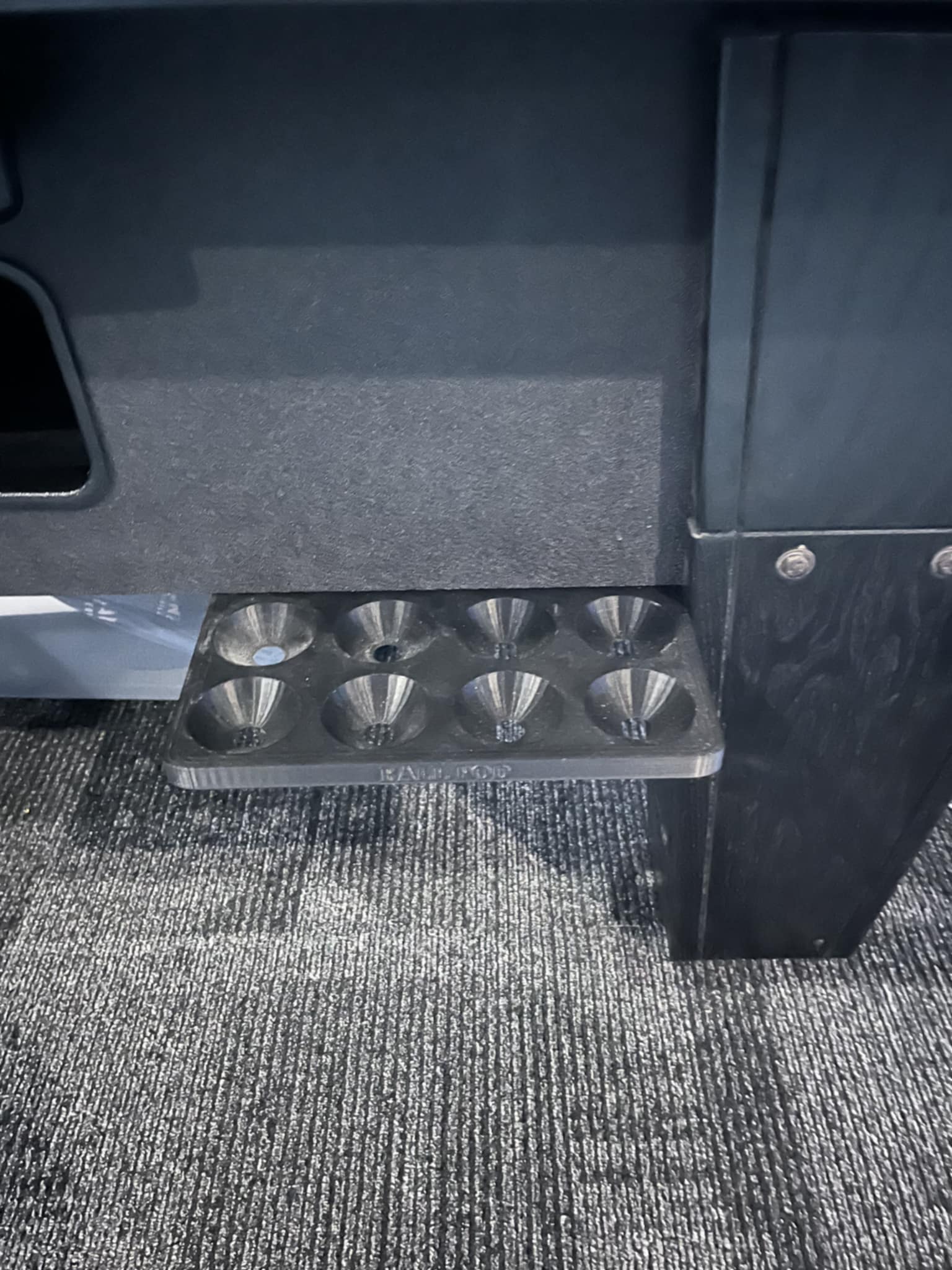 Ball Pod mounted to a pool table cabinet with spare balls parked in the tray.